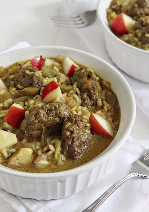 A picture of Curried Guinea Meatballs with Escarole and Basmati Rice.
