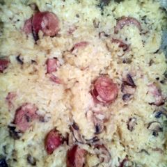 A picture of Portobello mushroom and sausage bake.