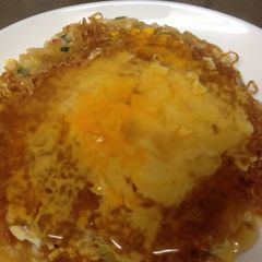 A picture of Chicken Ramen Okonomiyaki with Ankake Sauce.