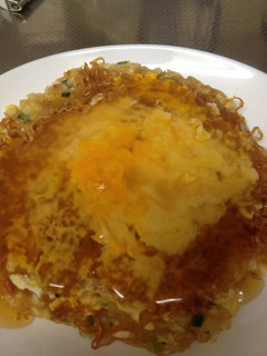 A picture of Chicken Ramen Okonomiyaki with Ankake Sauce.