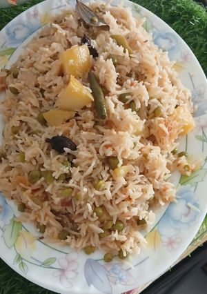A picture of Aloo, matar, polaw.
