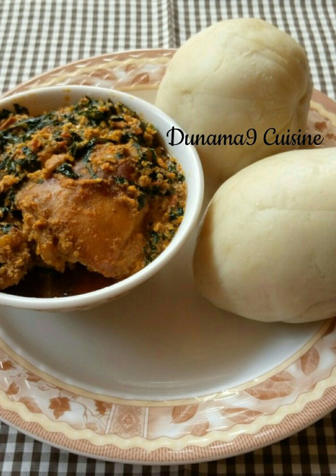 A picture of Pounded yam with ugu/egusi soup.
