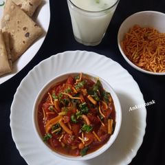 A picture of Sev Tomato Sabji - Gujarati dinner sabji with butter roti.