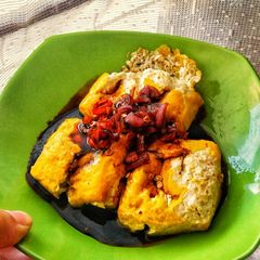 A picture of Fried Yellow Tofu with Sweet Soy Sauce and Chilli.
