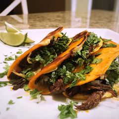 A picture of Short rib birria tacos/or ramen.