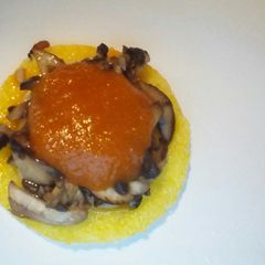 A picture of Polenta with mushroom and cheese.