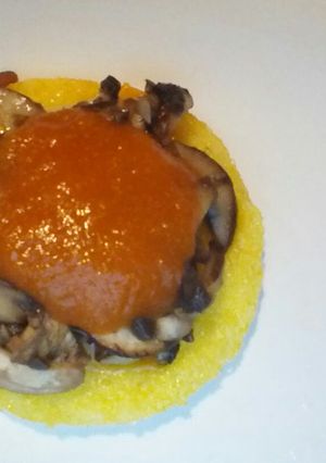 A picture of Polenta with mushroom and cheese.