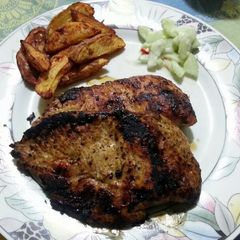 Cajun Chicken with Chilli Potatoes and Cucumber Salad A picture of Cajun Chicken with Chilli Potatoes and Cucumber Salad.