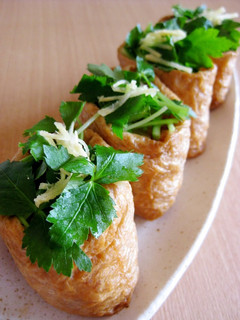 A picture of Inari Sushi with Minced Meat and Bamboo Shoots.