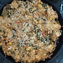 A picture of Baked vegetables with white sauce..
