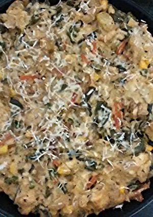 A picture of Baked vegetables with white sauce..
