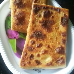 A picture of Mughlai paratha with egg.