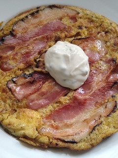 A picture of Omelette with caramelised onion, bacon and oyster sauce.
