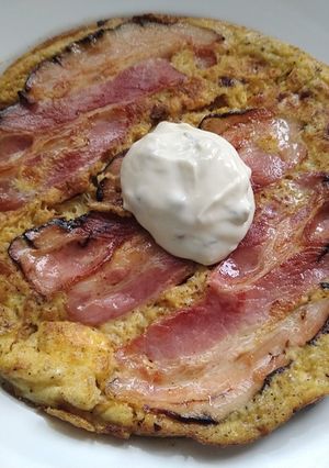 A picture of Omelette with caramelised onion, bacon and oyster sauce.