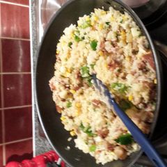 A picture of sausage and bacon risotto.