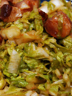 A picture of Wilted Napa Cabbage w/Bacon Lardons.
