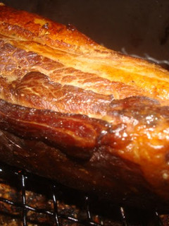 A picture of Homemade Bacon Smoked with Barley Tea in a Pot.