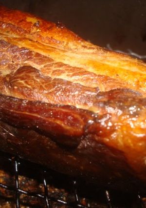 A picture of Homemade Bacon Smoked with Barley Tea in a Pot.