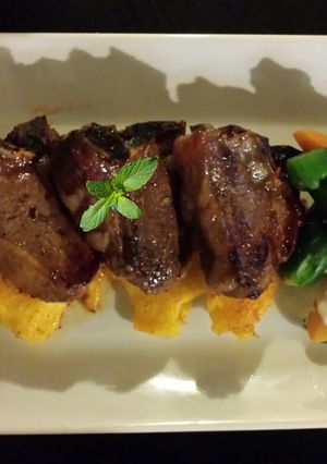 A picture of Orange mint Glazed Lamb Loins Fresh Summer Veggies and Creamy L.