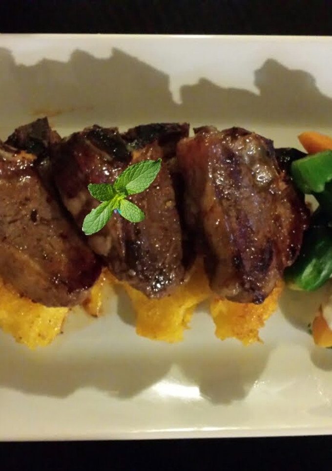 A picture of Orange mint Glazed Lamb Loins Fresh Summer Veggies and Creamy L.