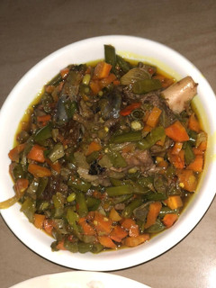 A picture of White rice and veggies sauce.