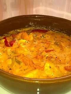 A picture of Shrimp baked in tomato and cheese sauce.