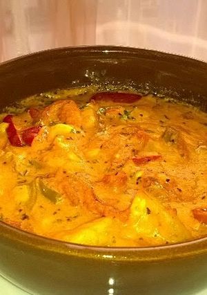 A picture of Shrimp baked in tomato and cheese sauce.