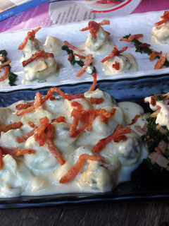 A picture of K's Kale Tortellini With Ham And Bacon In Four Cheese Sauce.
