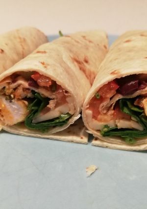 A picture of Chicken/ veggie wrap, Italian-style.
