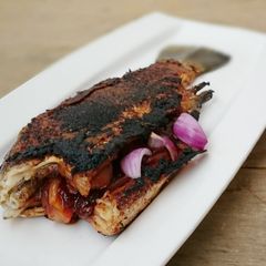 A picture of Stuffed Fish With Spicy Onion Sauce.