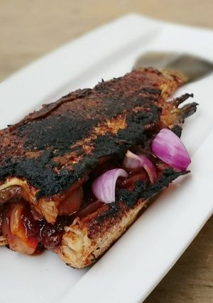 A picture of Stuffed Fish With Spicy Onion Sauce.