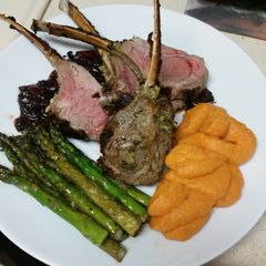 A picture of Rack of Lamb with cherry balsamic sauce.
