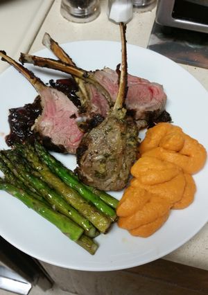 A picture of Rack of Lamb with cherry balsamic sauce.