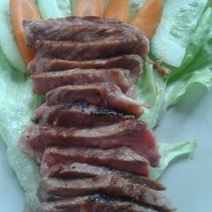 A picture of Shure rong hai, thai style barbecue steak.