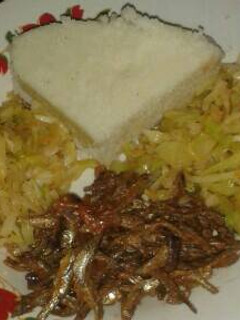 A picture of Ugali with cabbage and omena.