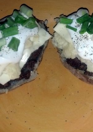 A picture of hamburger stuffed potato skins.