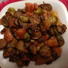A picture of Tindora (little gourd) with potato and tomato.
