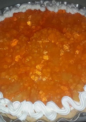 Una foto de Tarta de durazno y crema