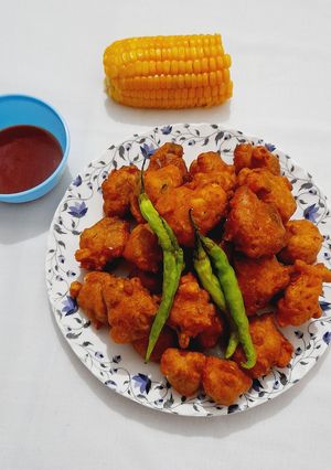 A picture of Crispy Corn, Bell Pepper, and Onion Fritters.