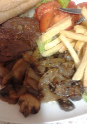 A picture of Gorgeous fried Onions and Mushrooms in garlic butter.