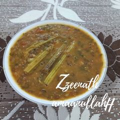 Sabut Masoor Ki Khatti Dal with Drumsticks A picture of Sabut Masoor Ki Khatti Dal with Drumsticks.