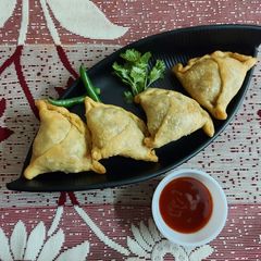 A picture of Spiced Onion Potato Stuffed Pastries or Samosa.