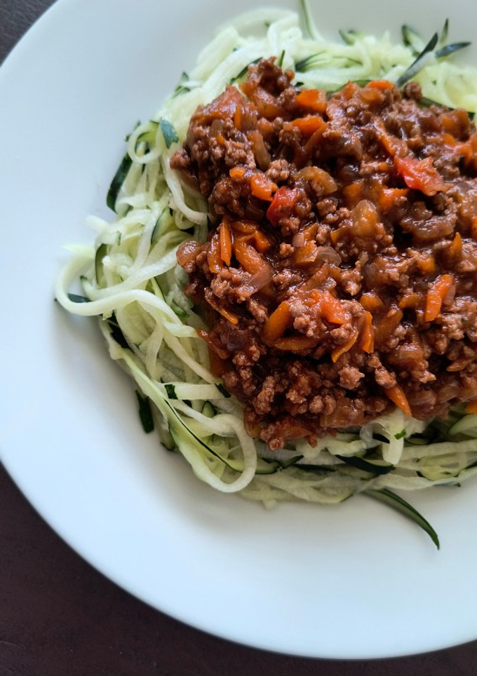 Una foto de Pasta de zapallo italiano con salsa boloñesa