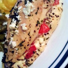 A picture of Tomato Basil and feta stuffed chicken breasts.
