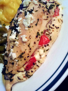 A picture of Tomato Basil and feta stuffed chicken breasts.