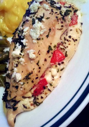 A picture of Tomato Basil and feta stuffed chicken breasts.