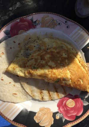 A picture of 3 Egg Omelette Served On A Tortilla Wrap.