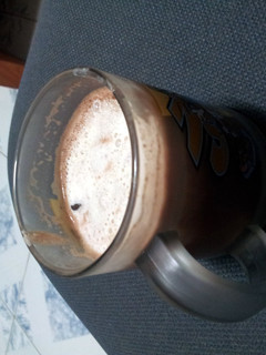 A picture of Cocoa cream with rocksalt and cheese foam.