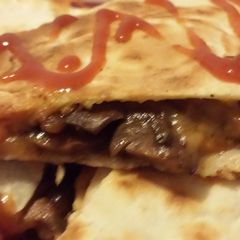 A picture of Cheesy steak and mushroom Quesadilla.