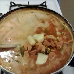 A picture of hotdog soup.